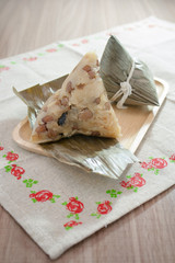 Asian Chinese rice dumplings or zongzi on wooden background