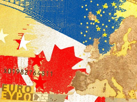 CETA - Comprehensive Economic and Trade Agreement
Kanadische Flagge hinter einem durchscheinenden Eurogeldschein
