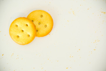 Gold cracker and chip biscuits on white background with copy space use for background - special effect
