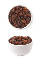 Cup filled with raisins isolated