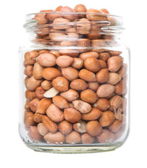 Peanuts or ground nuts in a mason jar over white background