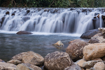 Obraz premium Dam handmade with stones A small river 