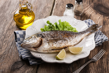 Baked fish dorado with vegetables