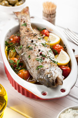 Baked fish trout with vegetables