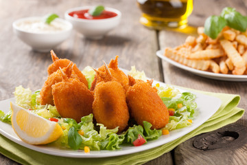 Baked in pastry shrimp with vegetables and french fries