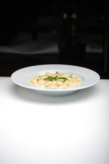 Gnocchi with mint leaves on top 