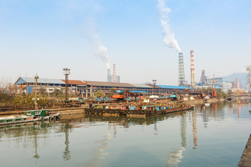 Obraz premium Industrial plant with smoke stacks, industrial area