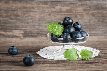 Fresh blueberries in a glass vase