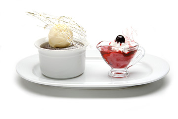 Pudding and ice cream with a cherry on top