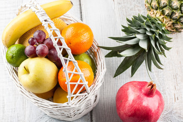 Mix of fresh fruits in the white bascket