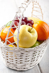 Mix of fresh fruits in the white bascket