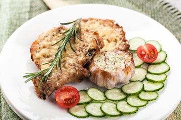 Fried pork chops with vegetables