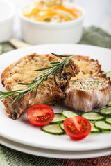 Fried pork chops with vegetables