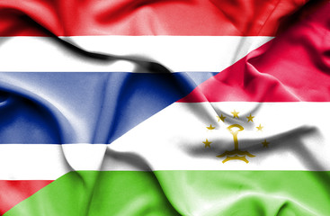 Waving flag of Tajikistan and Thailand