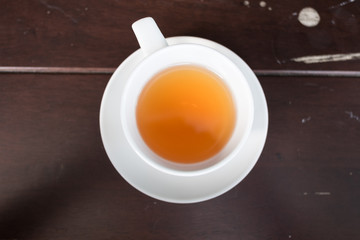 Fototapeta na wymiar White porcelain teacup and saucer with teapot