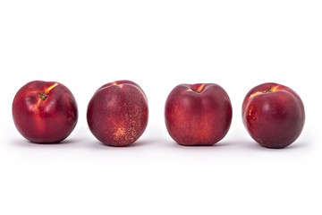 Fresh ripe organic nectarines isolated on a white background