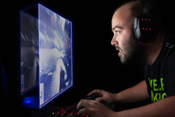 Gamer playing a first person shooter on high end pc.
