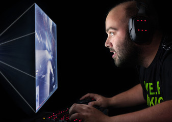Gamer playing a first person shooter on high end pc.
