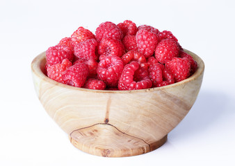 raspberries in a wooden bowl