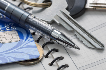 Diary, pen, credit card, coin and keys