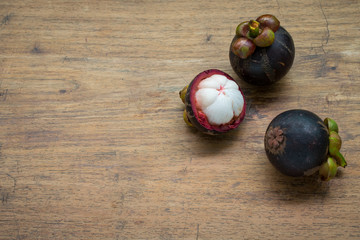 Fresh Mangosteen on wood background