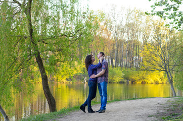 Fototapeta premium family dad mother and daughter on a walk on nature