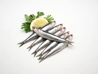 Foto op Plexiglas Fresh and raw mediterranean anchovy on white background © Shootdiem