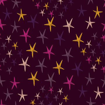 Seamless pattern with night sky and colorful hand drawn doodle stars.  Endless dark backdrop. Vector illustration.