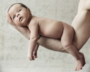 Father holding a newborn child