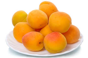 Apricots on a white plate