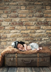 Little pilot baby sleeping on the luggage © konradbak