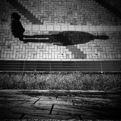 silhouette man walking down street