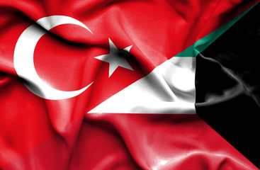 Waving flag of Kuwait and Turkey