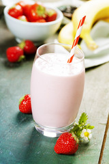 A glass of strawberry smoothie