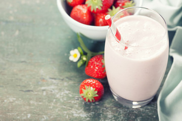 A glass of strawberry smoothie