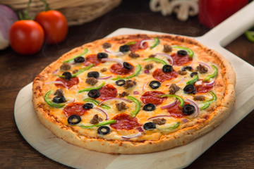 Close up of perfect pizza pie supreme deluxe toppings golden brown delicious