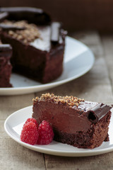 Creamy chocolate cake on white plate