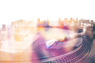 Turntable and vinyl record closeup, double exposure