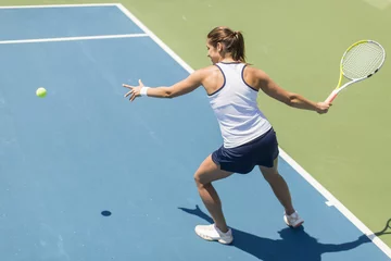 Deurstickers Young woman playing tennis © BGStock72