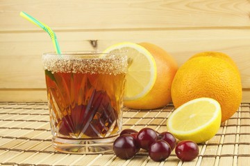 Glasses with cherries with rum. Preparing for summer refreshment cocktail. Cane rum and sugar. Sour pickled in rum.
