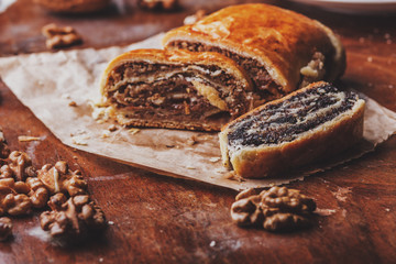 Poppy seed and walnuts strudel / cake on wooden table