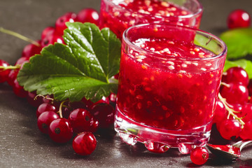 Fresh homemade jam rubbed red currants in a glass, selective foc