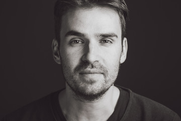 Portrait of a handsome young man. Studio shot.


