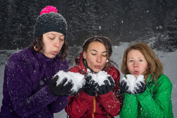 girls having fun in the snow