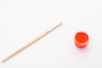 Paint in jars and brush