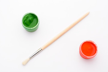 Paint in jars and brush