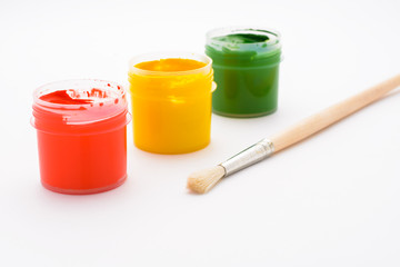 Paint in jars and brush