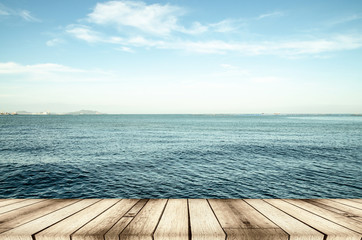 Fototapeta na wymiar Wood, blue sea and sky background