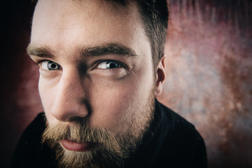 Portrait of a man peeping. funny picture. Wide-angle. Studio shot.
