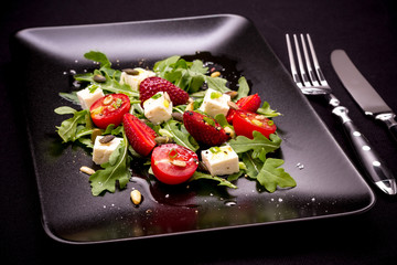 Strawberry, tomato salad with feta cheese, olive oil